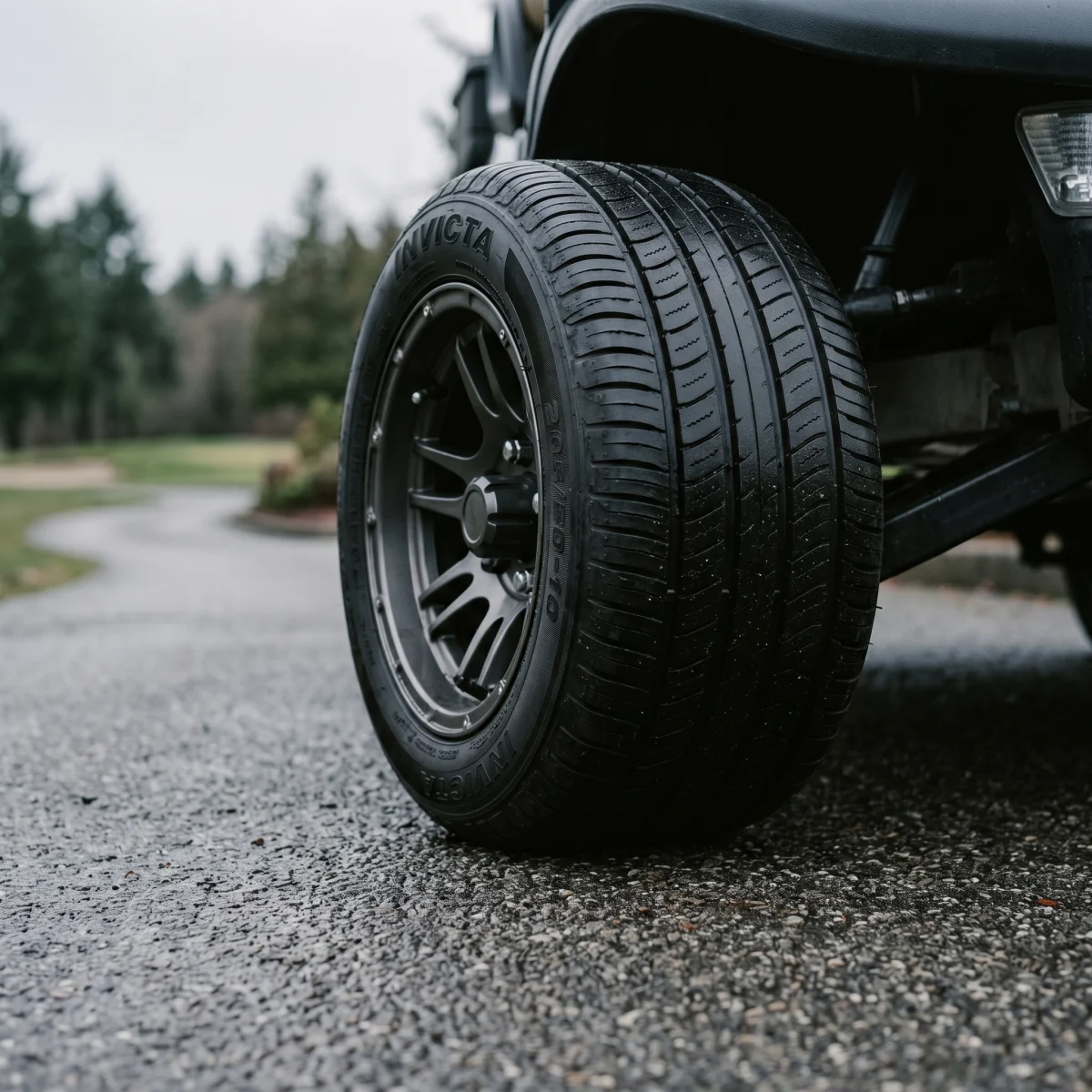 INVICTA STREETFOX mounted on a lifted street-legal cart, its ribbed low-profile tread sitting flat on tarmac